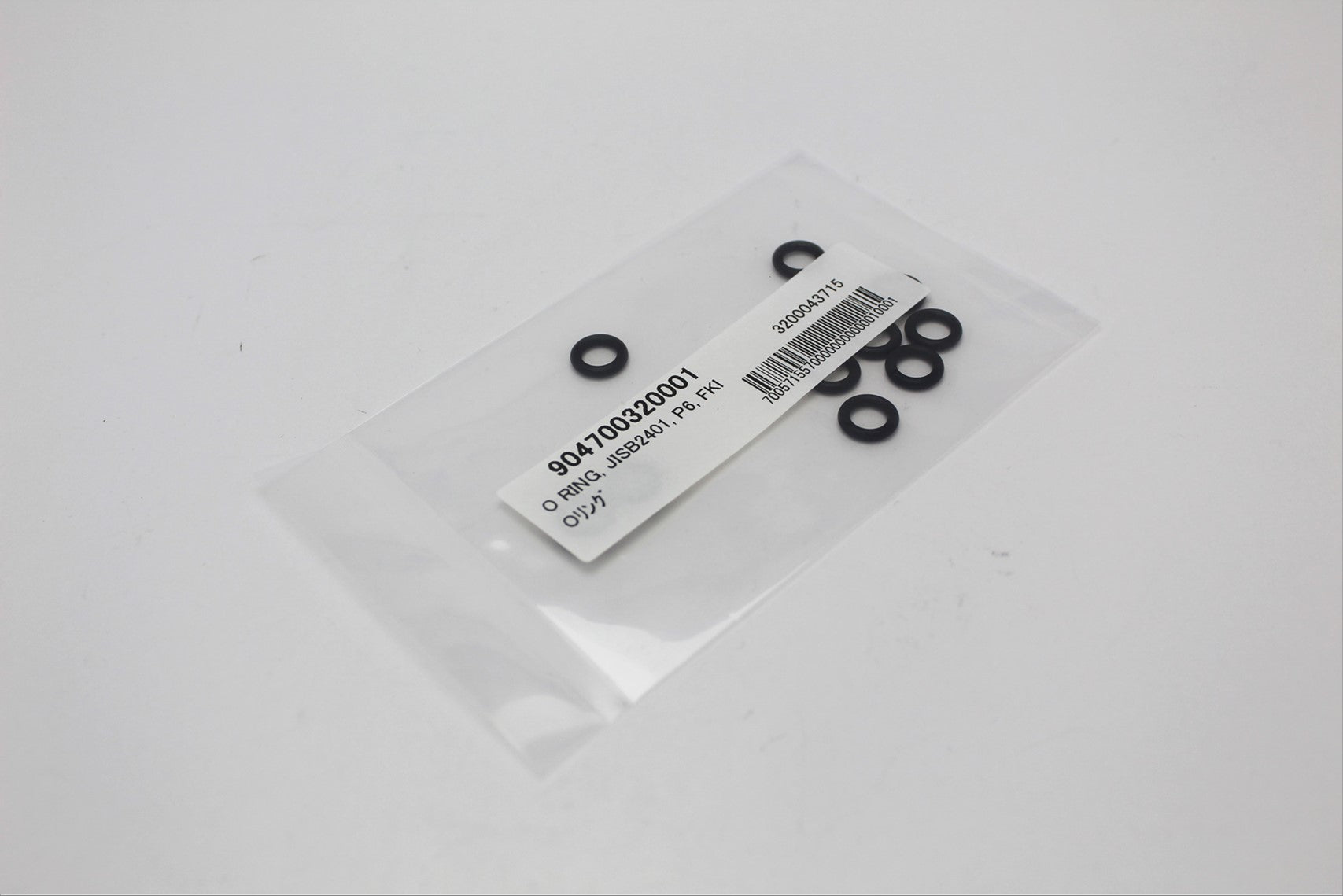 Photo of many black o-rings in bulk in a transparent bag