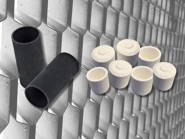 Photo of Ceramic and graphite crucibles on a metal background
