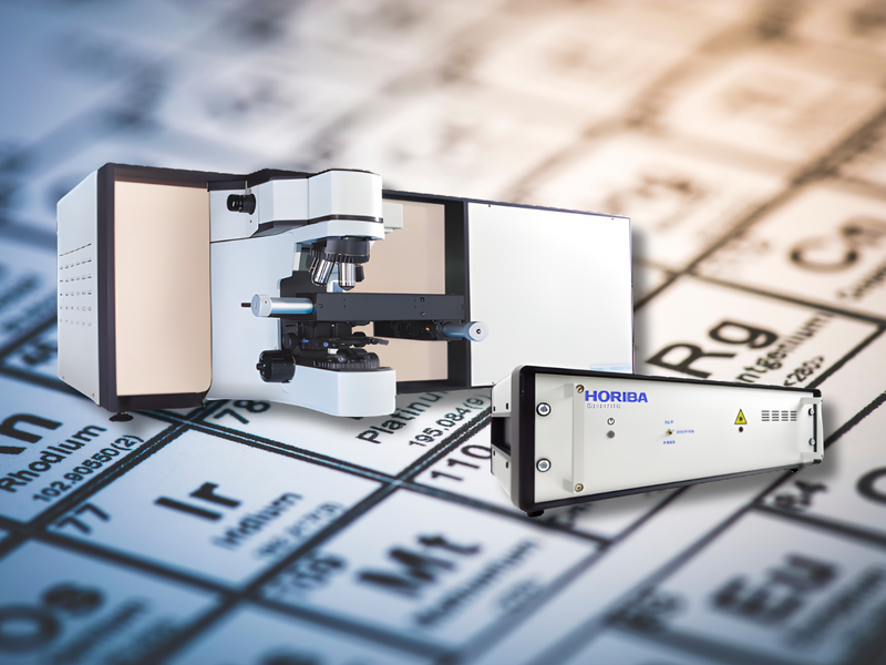Photo of LabRAM HR Electronics Upgrade with a background periodic table