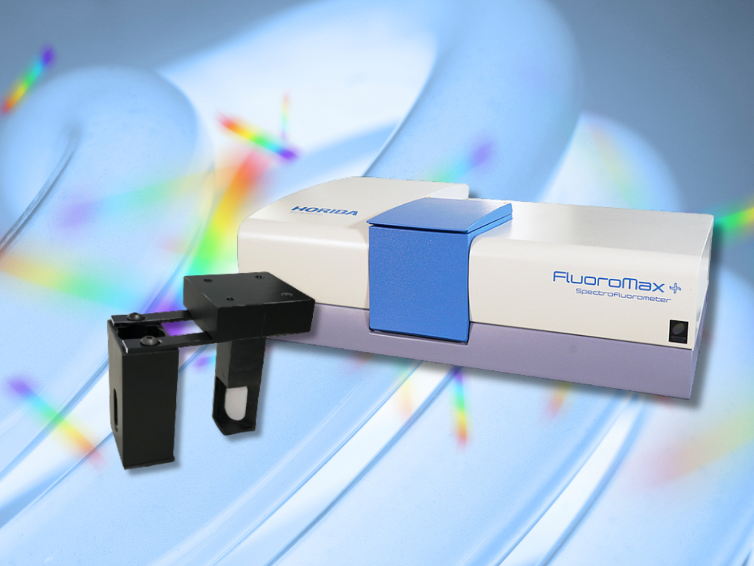 Photo of a FluoroMax instrument with the Absorption Accessory on a blue lamp background and spectra