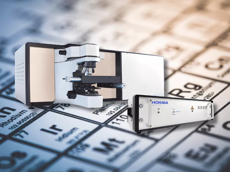 Photo of LabRAM HR Electronics Upgrade with a background periodic table