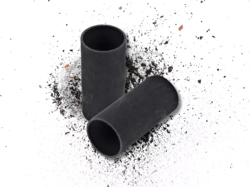 Photo of thwo graphite crucibles with graphite pieces.