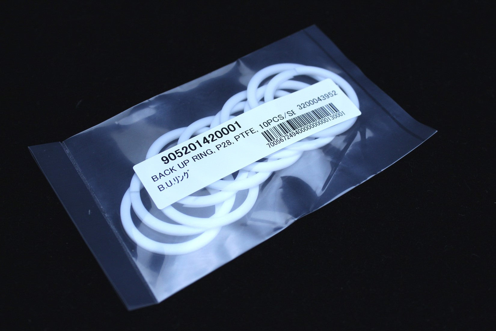Photo of a pack of Backup ring P28, Teflon SPIRAL (10pcs./Set) Lower electrode for HORIBA EMGA analyzer
