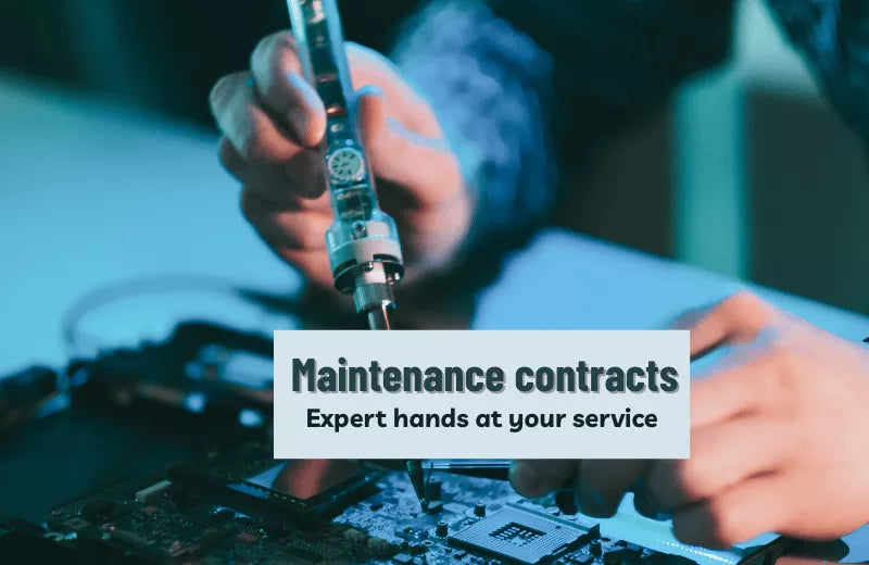 The hands of a service engineer performing maintenance on an electronic circuit board. 